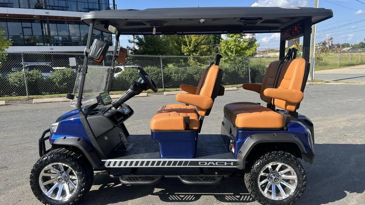 Blue DACH Apollo lithium golf cart side view with tan forward-facing seats and DACH badging