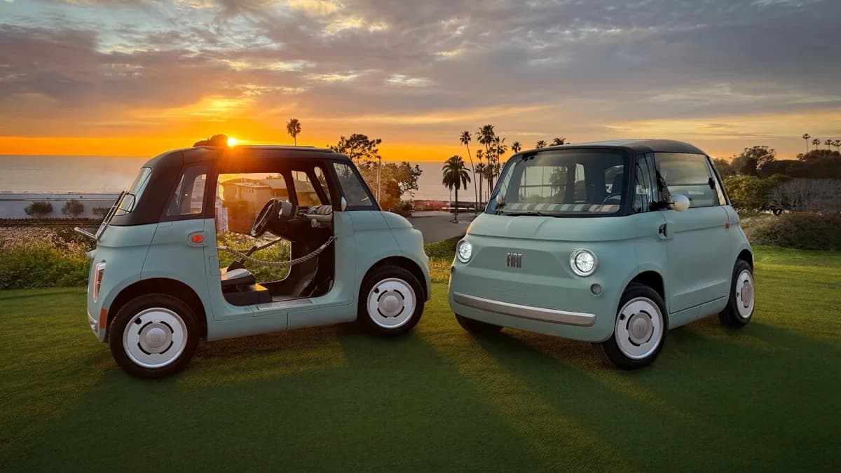Mint green FIAT Topolino and open-sided Topolino Dolcevita electric low-speed vehicles at sunset