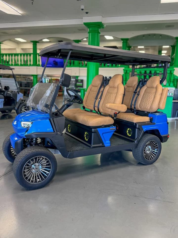 Sapphire blue Atlas ONE golf cart inside the Golf Car Superstore showroom
