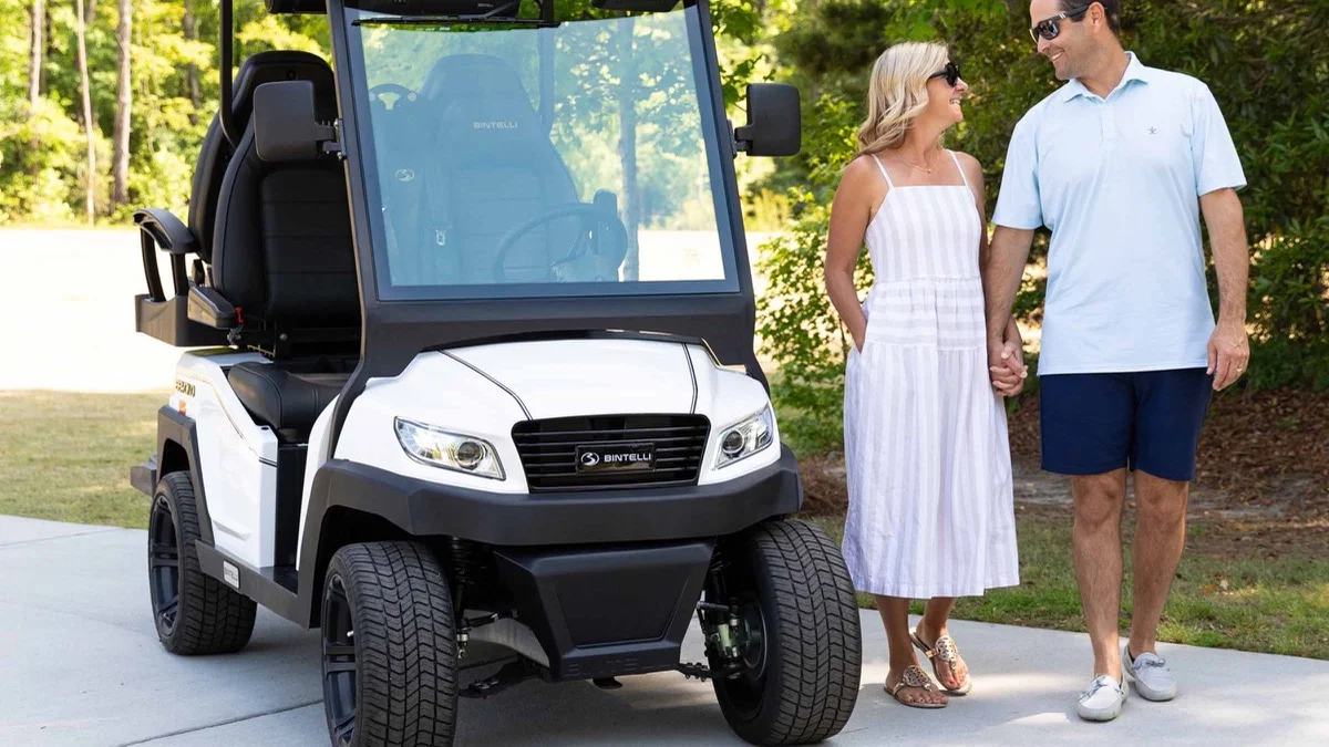 Bintelli golf cart review hero image showing a premium street-legal neighborhood golf cart at sunset