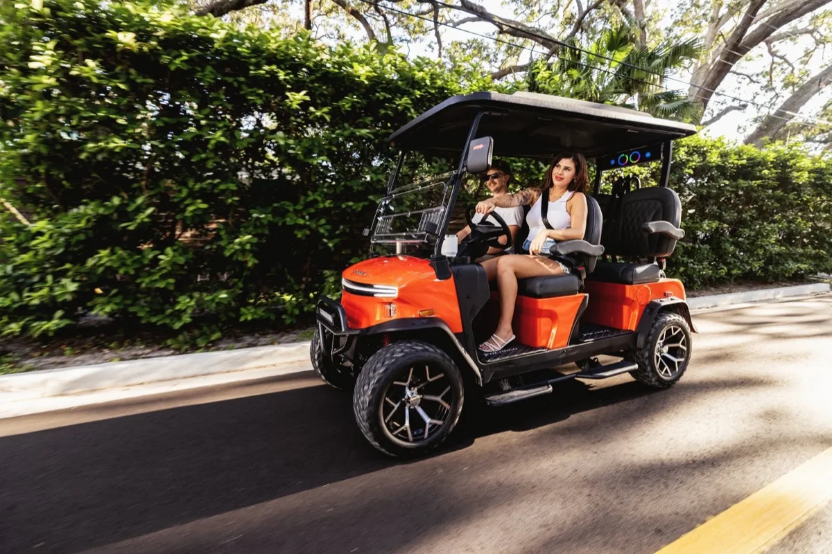 Denago golf cart hero image showing a premium electric neighborhood cart with modern styling